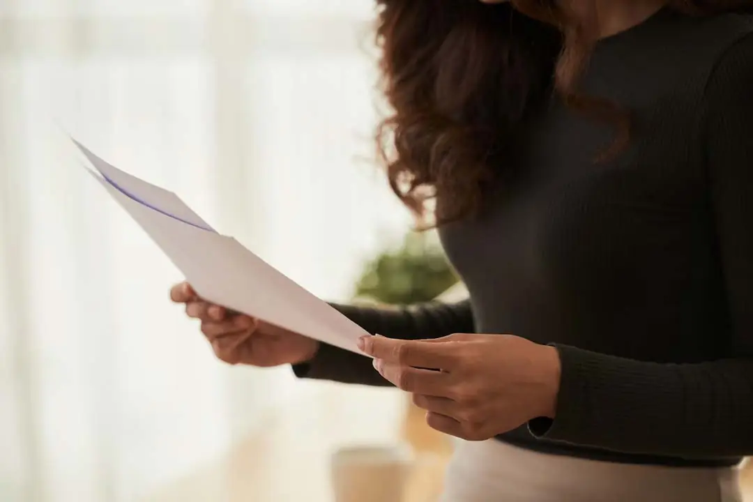 Woman analyzing company document