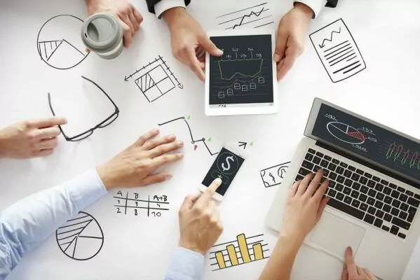 Hands on the table during a business meeting.