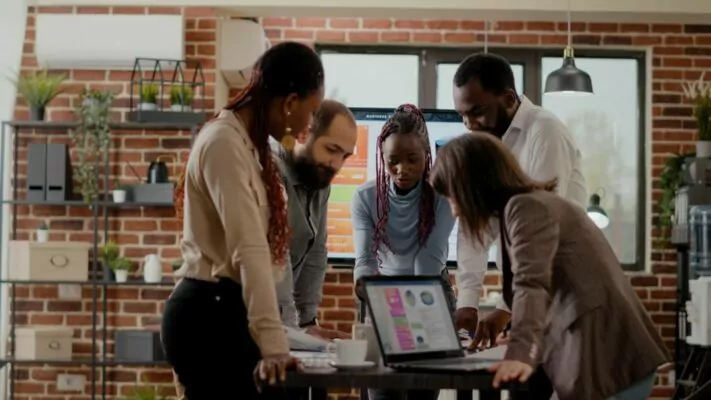 team-of-colleagues-analyzing-graphs-in-documents-to-plan-project-work