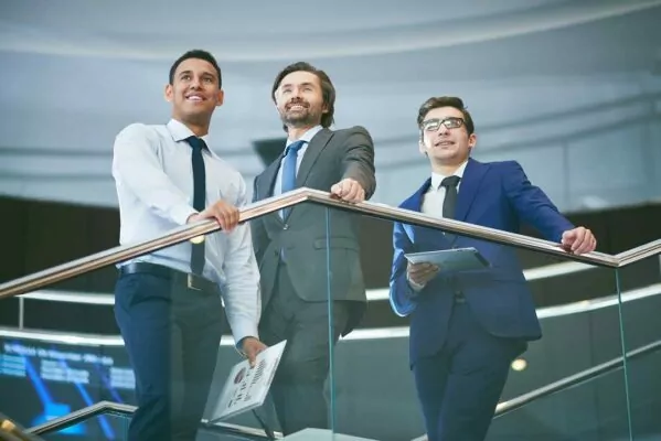 Three elegant businessmen in formalwear